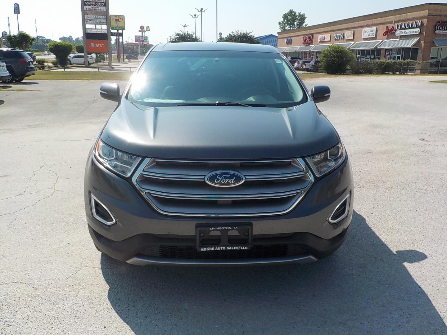 2016 Gray Ford Edge (2FMPK3K99GB) with an Ecoboost engine, Automatic transmission, located at 1617 W Church Street, Livingston, TX, 77351, (936) 327-3600, 30.710995, -94.951157 - What a family vehicle!! Titanium to boot! - Photo#0