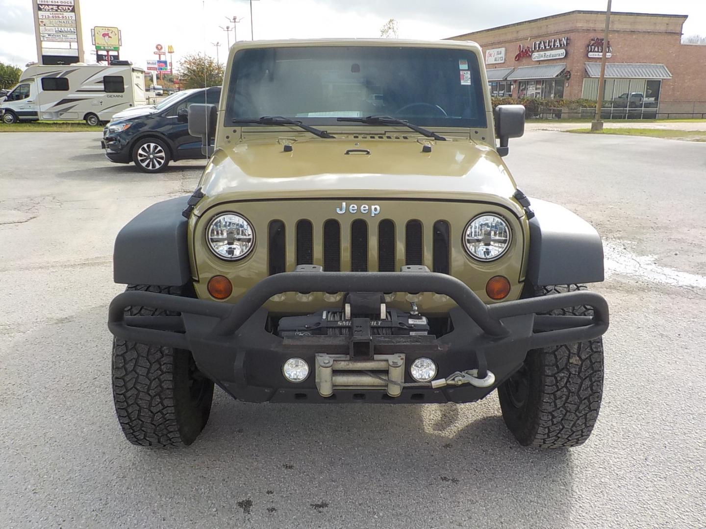 2011 Green Jeep Wrangler Unlimited Sport 4WD (1J4HA3H1XBL) with an 3.8L V6 OHV 12V engine, Automatic transmission, located at 1617 W Church Street, Livingston, TX, 77351, (936) 327-3600, 30.710995, -94.951157 - GOOD LOOKING JEEP!! WHEELS, TIRES, LIFT ALREADY! Good run and drive! - Photo#1