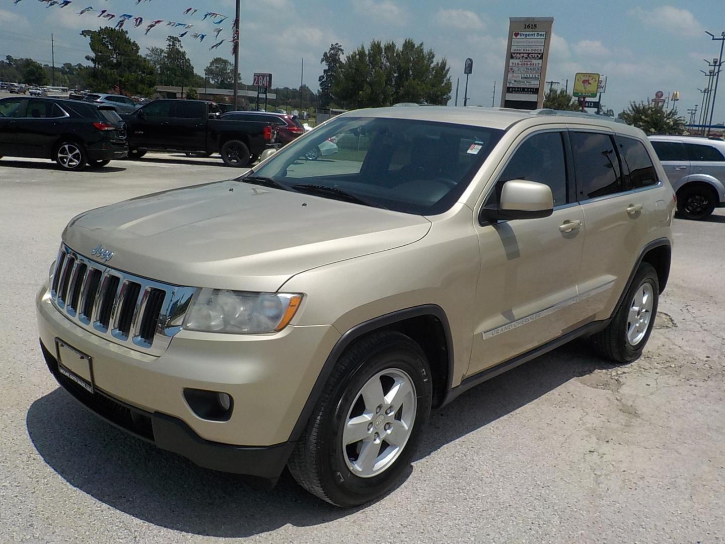 2011 Tan /Dk Gray Jeep Grand Cherokee Laredo 2WD (1J4RS4GG7BC) with an 3.6L V6 DOHC 24V engine, 5-Speed Automatic transmission, located at 1617 W Church Street, Livingston, TX, 77351, (936) 327-3600, 30.710995, -94.951157 - Local vehicle Serviced regularly! Come buy this one with confidence!! - Photo#3