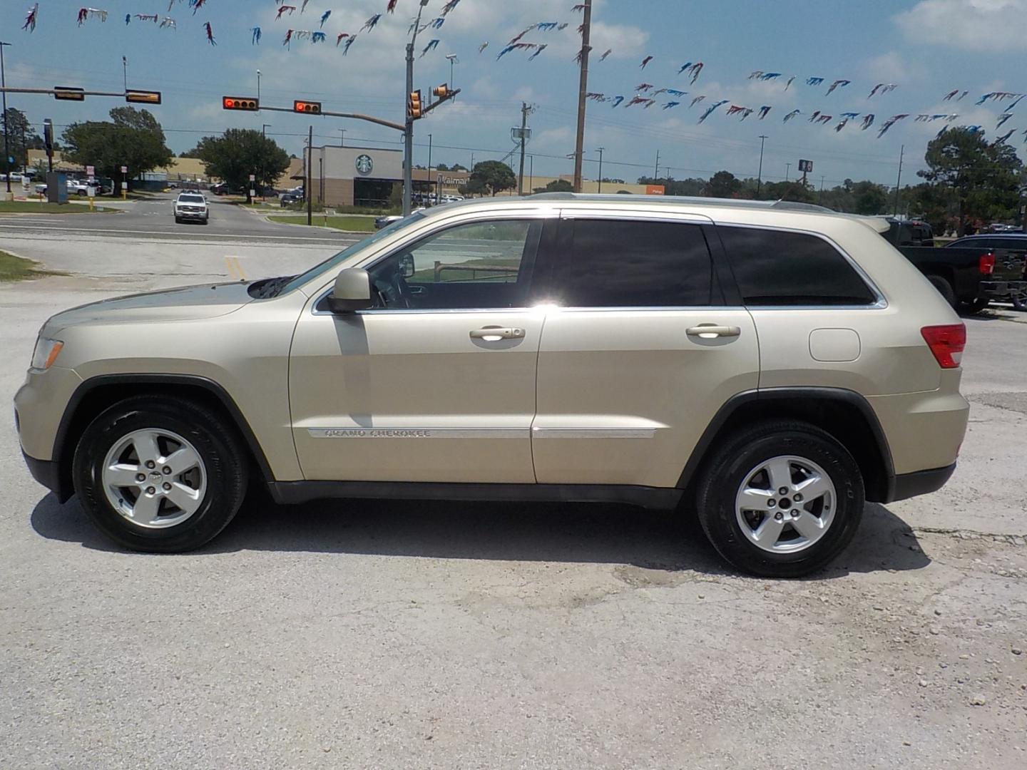 2011 Tan /Dk Gray Jeep Grand Cherokee Laredo 2WD (1J4RS4GG7BC) with an 3.6L V6 DOHC 24V engine, 5-Speed Automatic transmission, located at 1617 W Church Street, Livingston, TX, 77351, (936) 327-3600, 30.710995, -94.951157 - Local vehicle Serviced regularly! Come buy this one with confidence!! - Photo#4